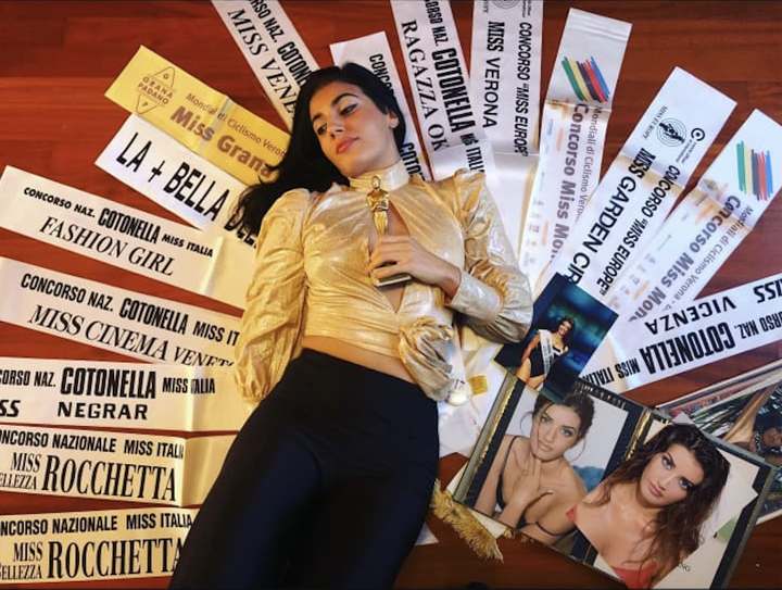 Recent staged photo of Valentina's personal collection of pageant sashes